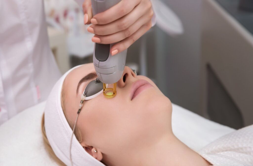 a patient receives an ipl treatment under their eyes to minimize wrinkles